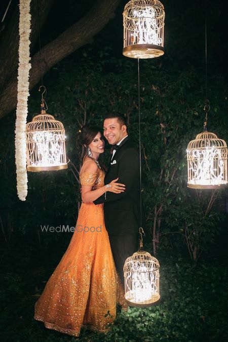 Photo of Couple portrait on reception with birdcage decor