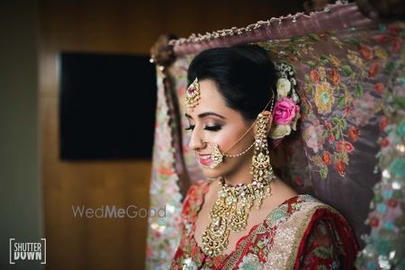 Photo of Dupatta placing on head floral embroidery