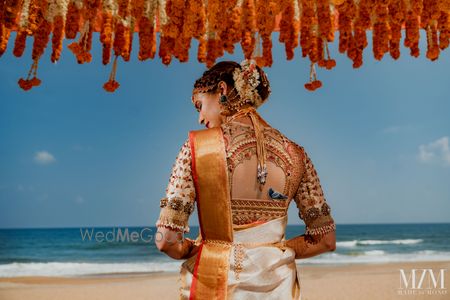 Photo of south indian bridal blouse in gold with unique back design