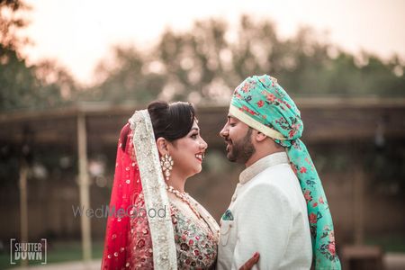 Photo of Floral safa for groom in turquoise