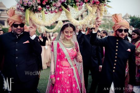 Photo of Bride entering under unique phoolon ki chadar