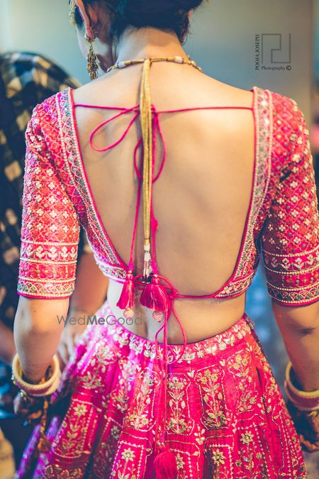 Photo of Deep bridal blouse back design