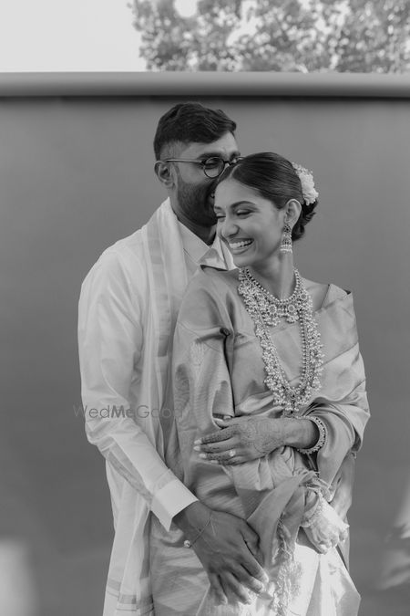 Photo of Classic couple portrait with the bride donning stunning layered guttapusalu necklaces.