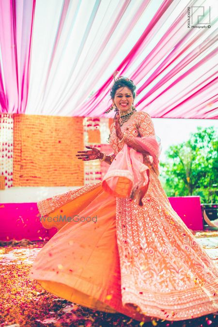 Orange Bridal Lehenga Photo Twirling bride