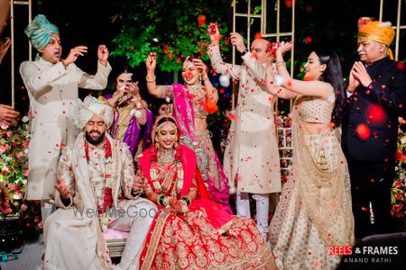 Photo of Happy couple shot with friends around them