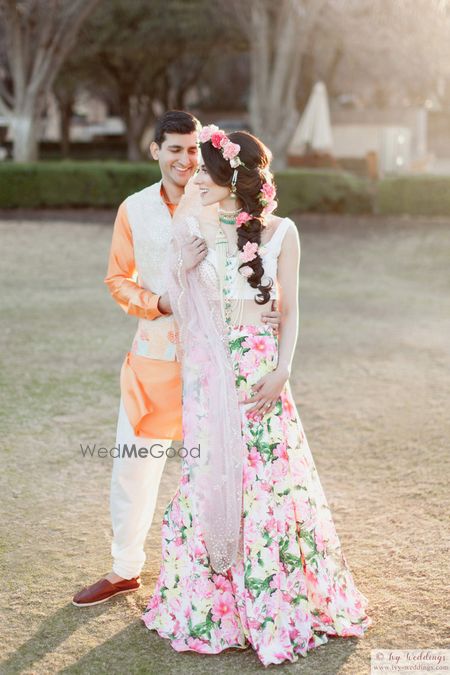 Photo of Floral print mehendi lehenga with floral hairstyle