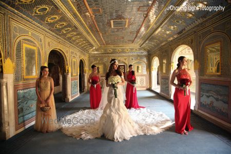 Photo of Bridesmaids with Bride wearing Gown with Train