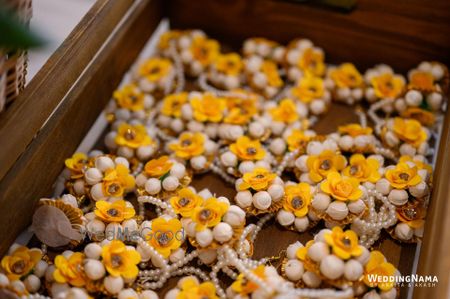 Photo of floral jewellery favours for mehendi on display