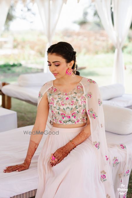 Photo of indo western mehendi outfit for bride with cape dupatta