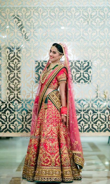 Photo of coral bridal lehenga