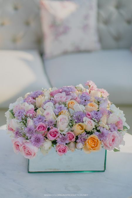 Photo of Floral centrepiece idea with coloured roses