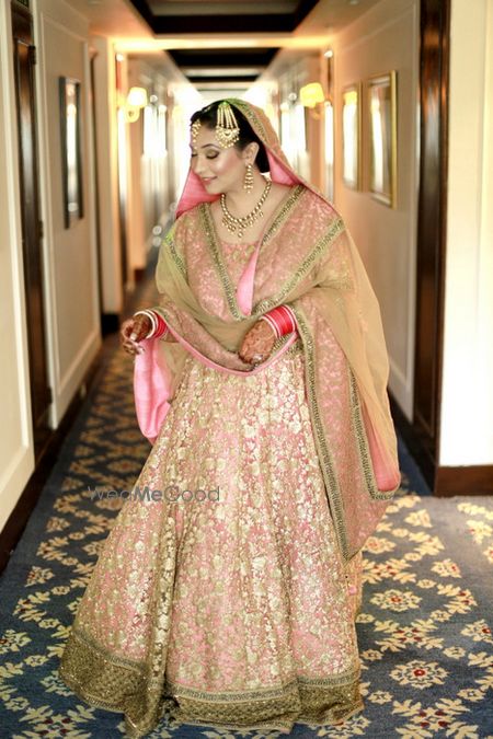 Photo of light pink and gold lehenga