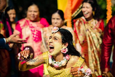 Photo of Bride with haldi on her face photo idea