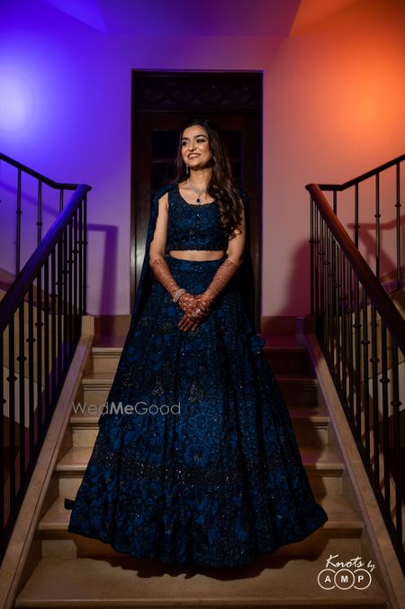 Photo of a heavily embellished blue lehenga that fit like a glove