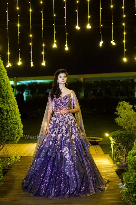 Photo of A bride in a purple shimmery gown for her cocktail