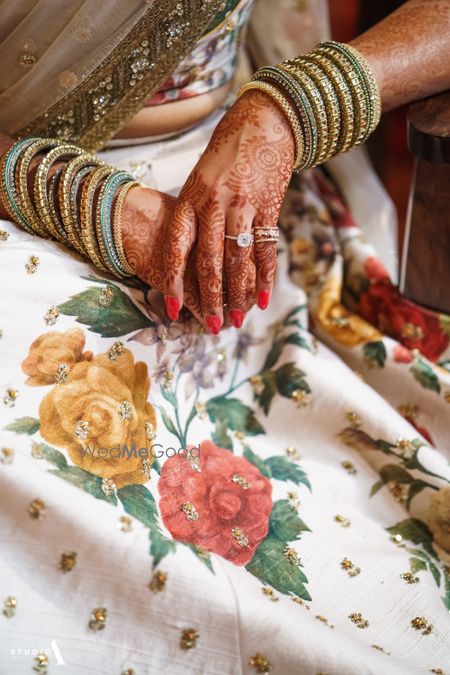 Photo of Bridal hands with mehendi and bangles