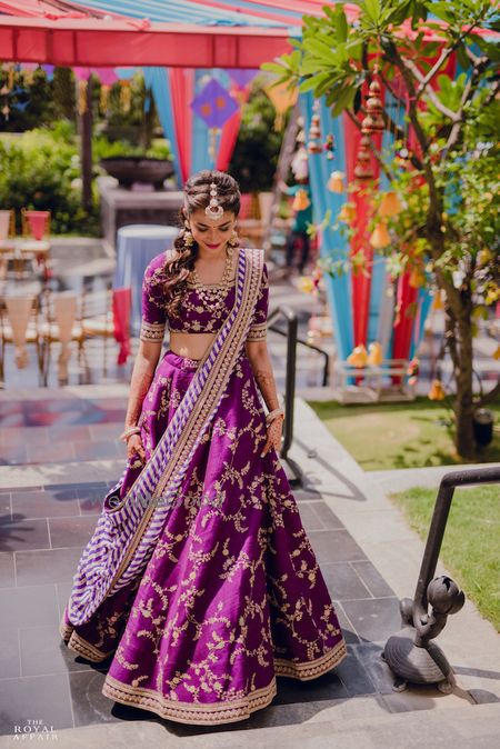 Photo of A bride in purple lehenga