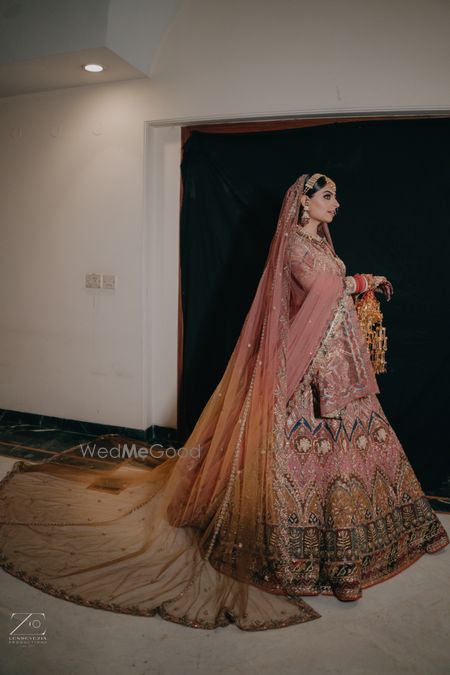 Photo of heavy peach bridal lehenga with kaleera