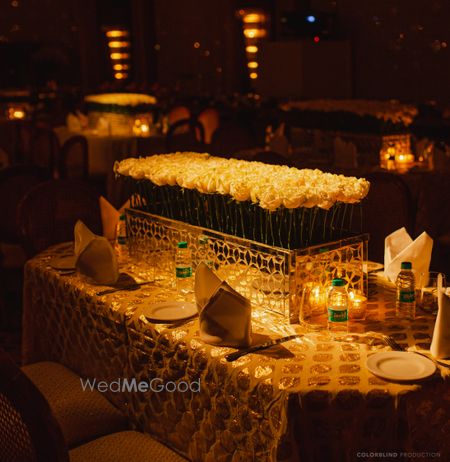 Photo of unique floral centrepiece idea for reception