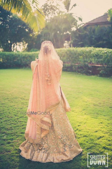 Photo of peach and pista green bridal lehenga