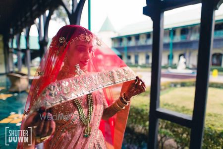 Photo of Bridal portrait with dupatta as veil