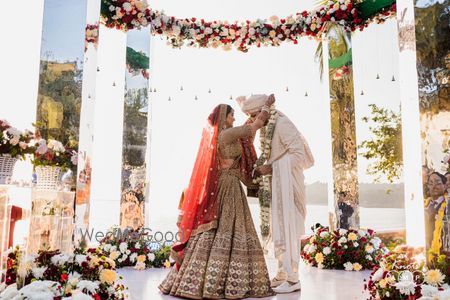 Photo of bride and groom at jaimala ceremony