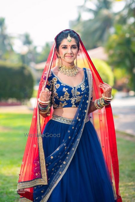 Photo of Sabyasachi bridal lehenga with contrasting dupatta