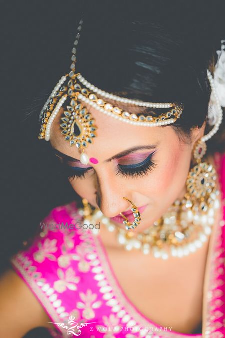 Photo of Pink smokey eye with bright pink lehenga