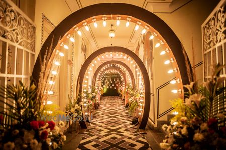 Photo of Glam entrance lined with lit tunnel for engagement ceremony