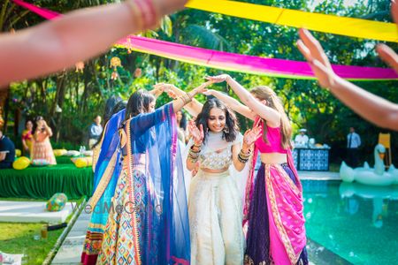 Photo of Bridal entry idea with bridesmaids holding hands