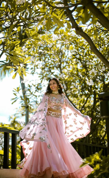 Photo of Light pink Indo western mehendi outfit with cape jacket