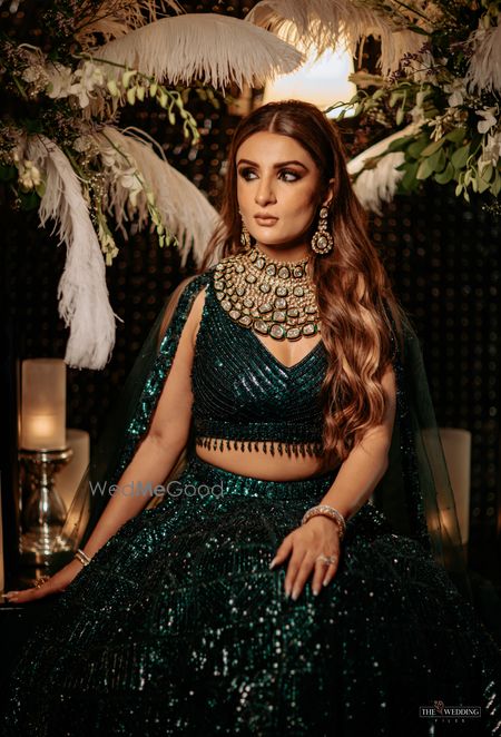 Photo of sequinned dark green lehenga