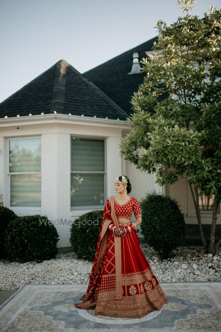 Photo of bridal look in a sabyasachi red and gold lehenga