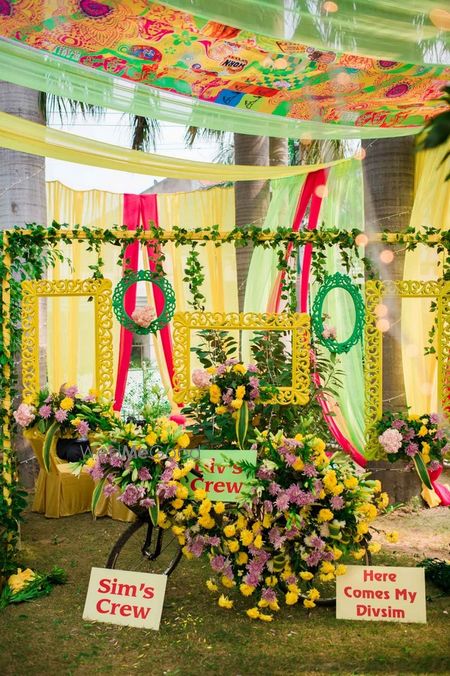 Photo of Yellow and green photobooth with frames