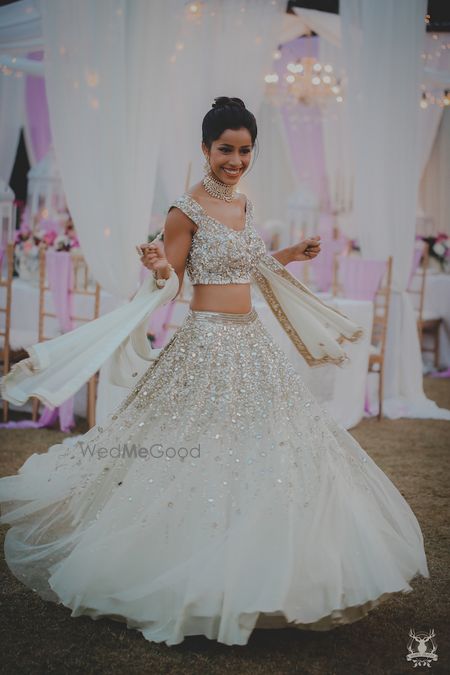 Photo of White and silver engagement lehenga