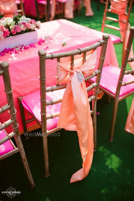 Photo of Chair backs with satin bow ties