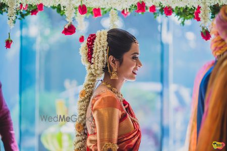 Photo of South indian bridal hairstyle with floral jada