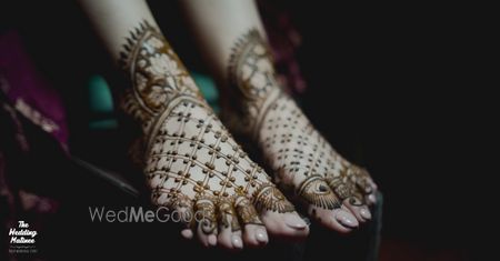 Photo of simple feet mehendi with evil eye motifs