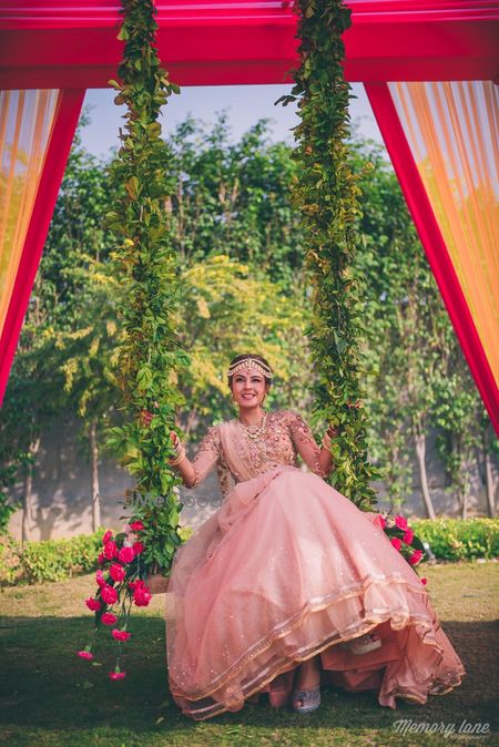 Photo of Indian bride on a swing