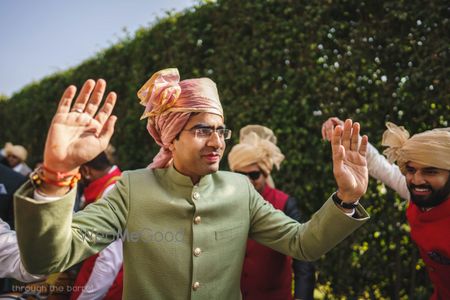 Photo of Groom in sage green sherwani and peach pink safa