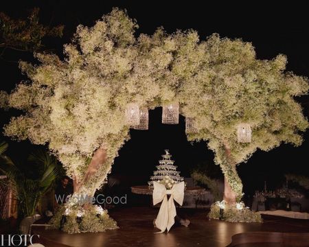 Photo of Unique and beautiful Tree-style all floral stage decor with bow detailing