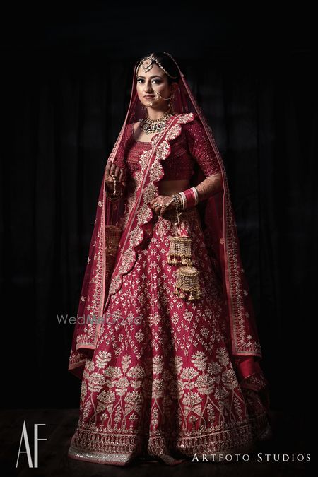 Photo of Royal bridal lehenga in maroon with scalloped edge