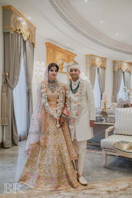 Photo of intimate wedding at home with pastel bride and groom