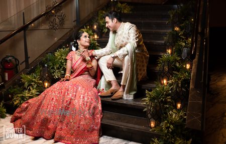 Photo of A couple pose on their wedding day