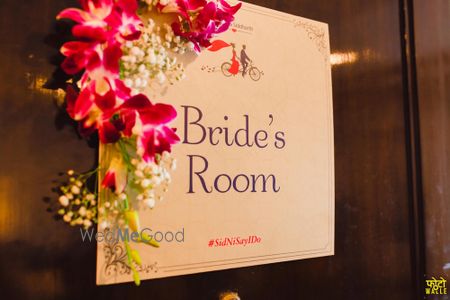 Photo of Bride's Room Personalised Card on Door with Flowers