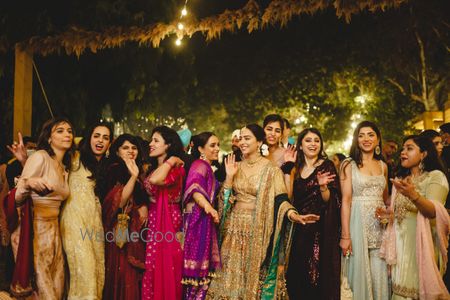 Photo of Candid and fun shot of bride and bridesmaids