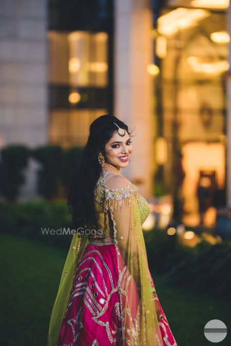 Photo of Happy bride shot with bride looking back