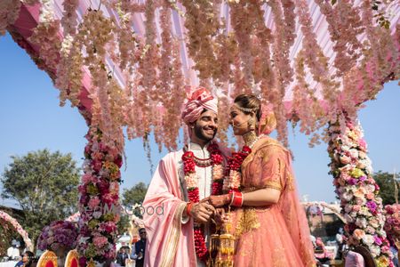 Photo of Couple in coordinated outfits for their wedding