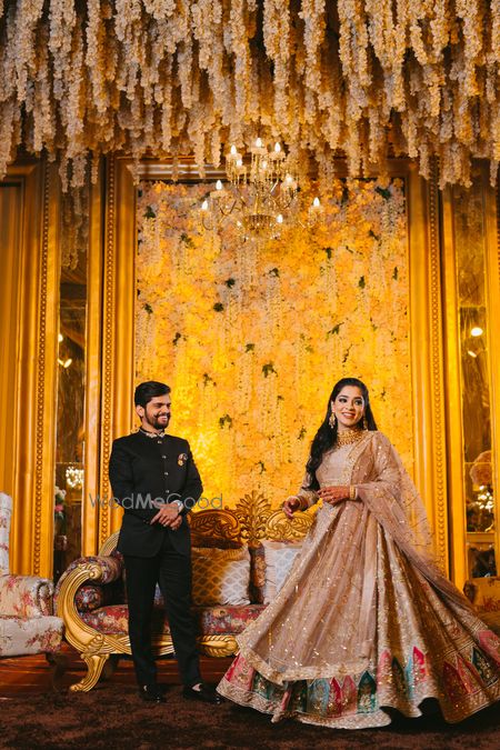 Photo of Groom looking at the bride with admiration.