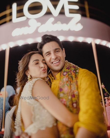 Photo of kiara advani and siddharth malhotra on their mehendi in cute couple pose